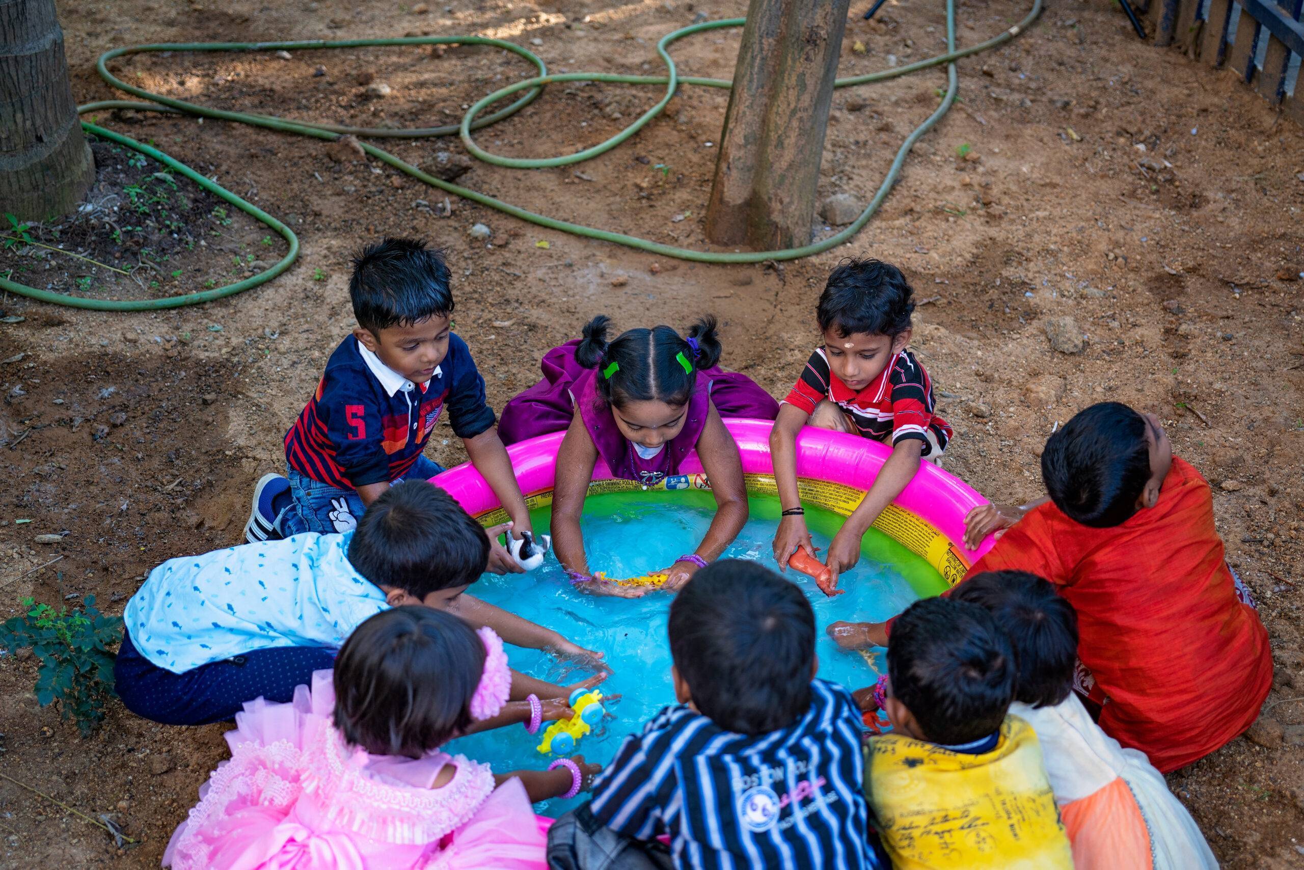 children playing in water plash